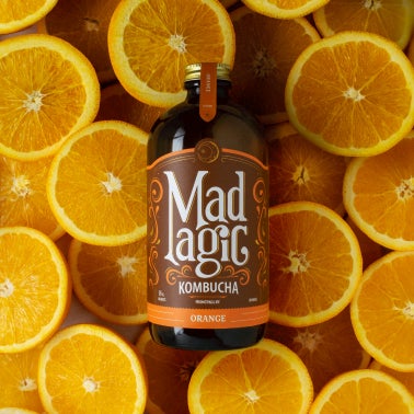 Mad Magic bottle with matching background 