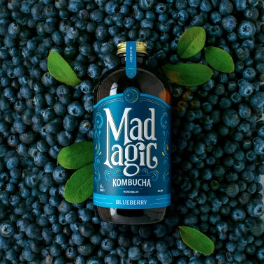 Mad Magic bottle with matching background 