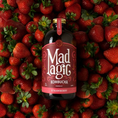 Mad Magic bottle with matching background 
