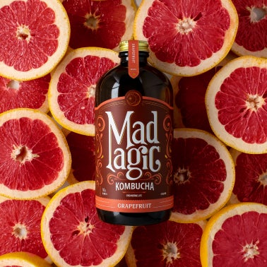 Mad Magic bottle with matching background 