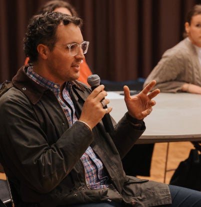 man speaking into a microphone