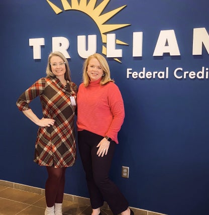 wildfire employees standing in front of sign